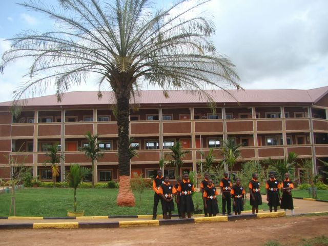 Secondary students in front of the main building